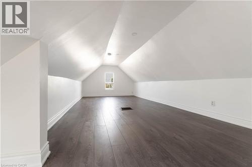 Bonus room with dark wood-style floors and vaulted ceiling - 934 Barton Street E Unit# 2, Hamilton, ON - Indoor Photo Showing Other Room