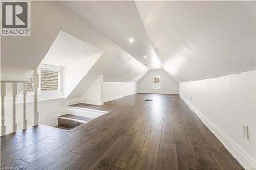 Additional living space featuring dark wood-style floors and vaulted ceiling - 934 Barton Street E Unit# 2, Hamilton, ON - Indoor Photo Showing Other Room