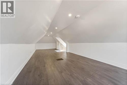 Additional living space featuring dark wood-style floors, vaulted ceiling, and recessed lighting - 934 Barton Street E Unit# 2, Hamilton, ON - Indoor Photo Showing Other Room