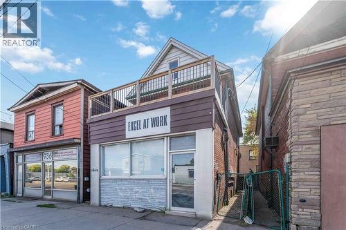View of front of house featuring stone siding and a gate - 934 Barton Street E Unit# 2, Hamilton, ON - Outdoor