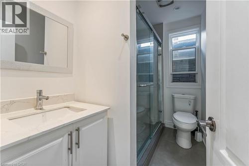 Bathroom with vanity, a stall shower, and concrete floors - 934 Barton Street E Unit# 2, Hamilton, ON - Indoor Photo Showing Bathroom