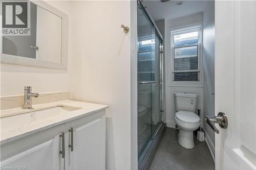 Bathroom featuring vanity, a stall shower, and concrete flooring - 934 Barton Street E Unit# 2, Hamilton, ON - Indoor Photo Showing Bathroom
