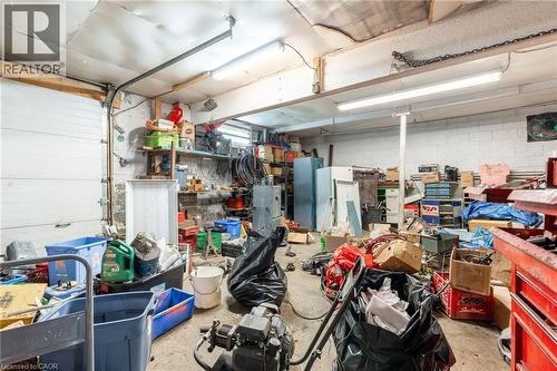 Garage featuring concrete block wall - 24 Clark Avenue, Hamilton, ON 