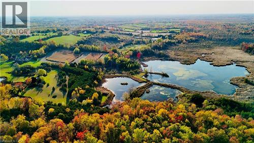 Aerial view of property's location with a forest and a nearby body of water - 1041 8Th Concession Road W, Flamborough, ON - Outdoor With View