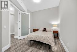 Bedroom with Queen Bed and laminate  flooring - 