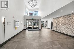 Lobby featuring recessed lighting and a towering ceiling - 