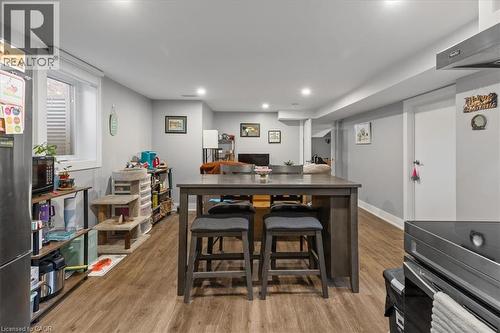 Dining room featuring light wood-style floors, recessed lighting, and a desk - 50 Grove Crescent, Brantford, ON - Indoor