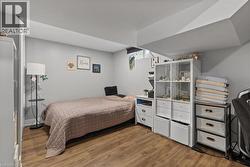 Bedroom with light wood-type flooring - 