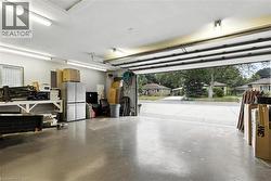 Garage with freestanding refrigerator and a heating unit - 