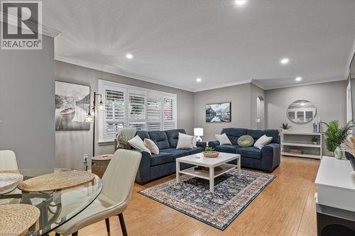 Living room featuring crown molding, light wood finished floors, and recessed lighting - 50 Grove Crescent, Brantford, ON - Indoor Photo Showing Living Room