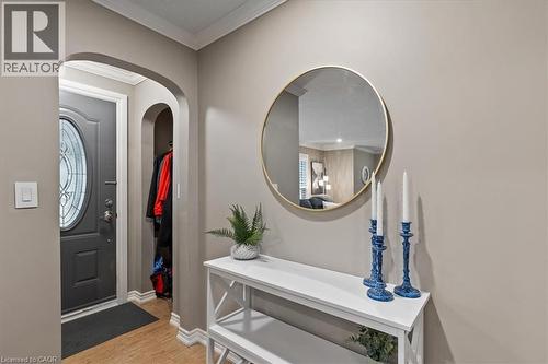 Foyer with ornamental molding and light wood finished floors - 50 Grove Crescent, Brantford, ON - Indoor
