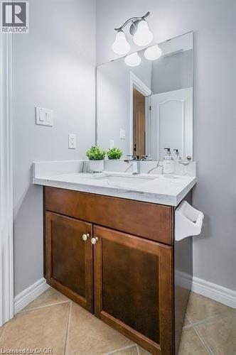 Bathroom featuring vanity and light tile patterned floors - 609 Woolgrass Avenue, Waterloo, ON - Indoor Photo Showing Bathroom