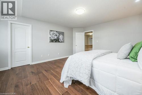 Bedroom featuring wood finished floors and baseboards - 609 Woolgrass Avenue, Waterloo, ON - Indoor Photo Showing Bedroom