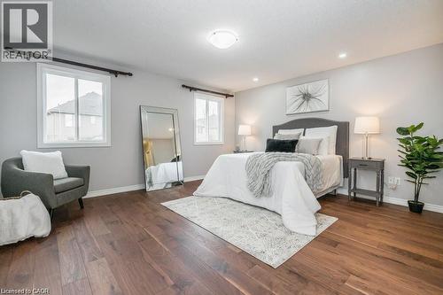 Bedroom with dark wood-type flooring - 609 Woolgrass Avenue, Waterloo, ON - Indoor Photo Showing Bedroom