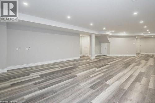 Finished below grade area with recessed lighting and light wood finished floors - 609 Woolgrass Avenue, Waterloo, ON - Indoor Photo Showing Other Room
