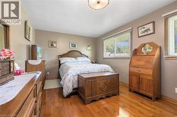 Bedroom featuring wood finished floors - 