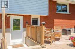 View of exterior entry with brick siding - 