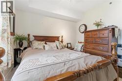 Carpeted bedroom with ceiling fan - 