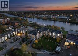 Aerial view of property and surrounding area featuring a nearby body of water - 