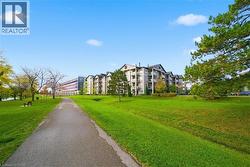 View of home's community with a yard - 