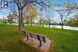 Surrounding community with a lawn and a water view - 