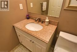 Bathroom featuring vanity and toilet - 