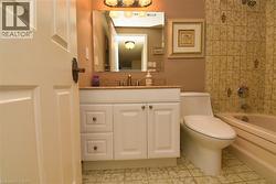 Bathroom featuring vanity and shower / tub combination - 