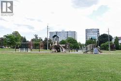 Community jungle gym featuring a yard - 