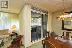 Dining room featuring a chandelier and carpet floors - 