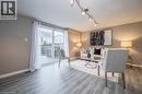 Living area featuring track lighting and wood finished floors - 27 Max Becker Drive, Kitchener, ON  - Indoor Photo Showing Living Room 