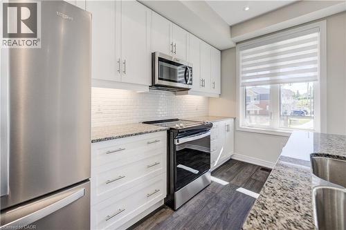 10 Birmingham Drive Unit# 116, Cambridge, ON - Indoor Photo Showing Kitchen With Stainless Steel Kitchen With Upgraded Kitchen