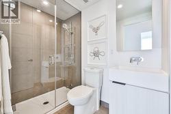 Full bathroom with vanity, a shower stall, tile patterned flooring, and recessed lighting - 