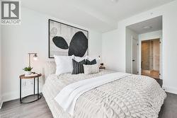 Bedroom with wood finished floors and ensuite bathroom - 