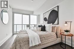 Bedroom featuring baseboards and wood finished floors - 