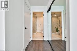 Hallway with dark wood-type flooring - 
