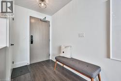 Foyer with dark wood-type flooring and baseboards - 