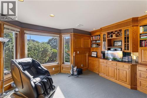 Executive office with artisanal wood detailing, neutral Berber carpet with large, oversized windows to allow lots of natural light, recessed lighting. This room can be used as a 5th bedroom. - 7775 St. Augustine Crescent, Niagara Falls, ON - Indoor
