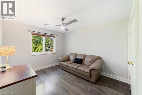 4th bedroom, currently used as a sitting room with oversized windows and full-sized closet, wood flooring, fan, intercom - 7775 St. Augustine Crescent, Niagara Falls, ON - Indoor Photo Showing Other Room