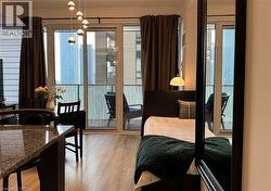 Large windows, light vinyl finished floors, and access to exterior - 