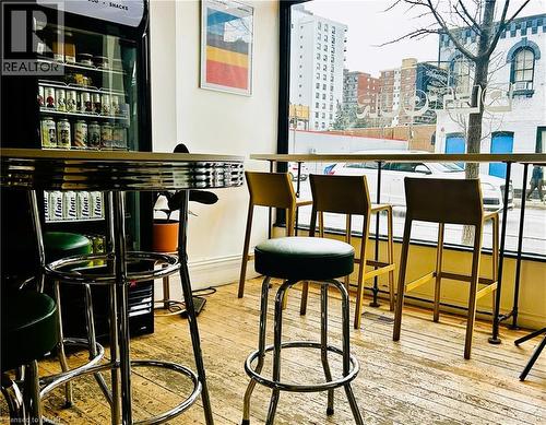 Indoor dry bar featuring a city view - 175 John Street S, Hamilton, ON 