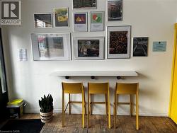 Bar area with hardwood / wood-style floors and baseboards - 