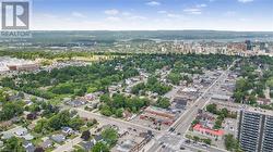 Aerial view of property and surrounding area featuring nearby urban area - 