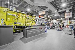 Misc room featuring a workshop area and rubber floors - 