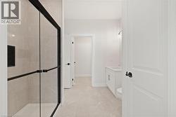 Full bathroom featuring vanity and a shower stall - 