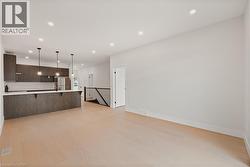 Unfurnished living room with recessed lighting and light hardwood floors - 