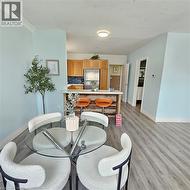 Dining space with light wood finished floors and baseboards - 