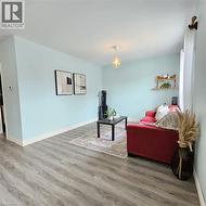 Living area featuring wood finished floors - 