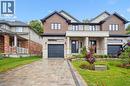 Semi-detached home with a 1-car garage and paver stone driveway & walkway - 548 Peach Blossom Court, Kitchener, ON  - Outdoor With Facade 