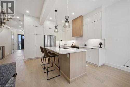 Open-concept kitchen, living room & dinette with large windows & 10' ceilings - 548 Peach Blossom Court, Kitchener, ON - Indoor Photo Showing Kitchen With Upgraded Kitchen