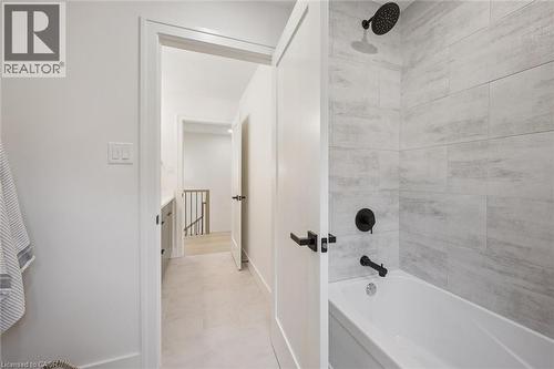 Second floor shared bathroom with a separate room with the bathtub & toilet - 548 Peach Blossom Court, Kitchener, ON - Indoor Photo Showing Bathroom